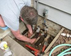 Irrigation specialist in Mesa, Arizona inspects a water line